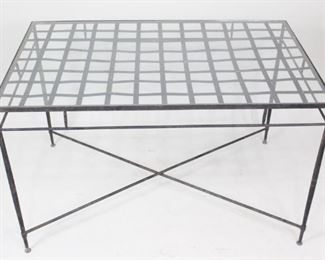 Lot 304: Wrought Iron Modern Patio Garden Dining Table,Glass Top. Handsome rectangular table has a wrought iron frame with a gridded top; glass top sits in a lip. Frame is painted black and has an x shaped crossbar. Wonderful for garden, patio or porch.
Dimensions are 29 in h x 48 in w x 30.5 in d. Condition is good with surface rust. Please call or email for a detailed condition report.

