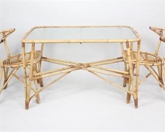 Lot 305: Mid-Century Modern Bamboo Rattan Patio Table w/2 Chairs. Wonderful dining table with two chairs in bent bamboo. Table with rounded corners and table top in textured glass and beautiful details. The pair of chairs have a great rounded shape reminiscent of Danish mid-century design.

Dimensions are 27 in h x 27.75 in w x 44.25 in d. Condition is good. Some wear and slight discoloration. Please call or email for a detailed condition report.