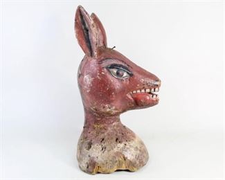 Lot 311: African Tribal Deer Hunting Headdress Statue Sculpture. Ethnographic sculpture carved in solid wood depicting a deer. Painted red with wonderfully carved and painted eyes, mouth and ears. Several nails throughout the sculpture, notably around the base of the neck and at top of head, potentially indicates that the sculpture was once covered in animal skin and part of a ceremonial costume. Possibly of Yoruba or Krio origin of Nigeria or Sierra Leone.

Dimensions are 14.75 in h x 6.25 in w x 8.5 in d. Condition is fair. Overall wear, paint loss, chips and some discoloration. Please call or email for a detailed condition report.