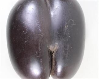 Lot 313: Polished Coco De Mer Fertility Nut Specimen,Seychelles. Beautifully polished example of the highly coveted Coco De Mer (Lodoicea Maldivica) or Sea Coconut. A polished seedpod from the Lodoicea palm tree, which is native to the Seychelles Islands in the Indian Ocean. Display this rare specimen on a stand as sculpture.

Dimensions are 5 in h x 9.25 in w x 7 in d. Condition is very good with some surface wear . Please call or email for a detailed condition report.

