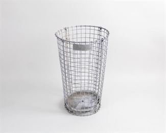 Lot 333: Industrial Metal Wire Waste Basket,Laundry,Garbage Can. A galvanized metal wire waste basket, possibly from Norwich Wire Works. Solid metal bottom with one drainage hole and plaque at top with partial label. Use as trash can, for fire logs or any other storage needs.

Dimensions are 30 in h x 17.5 in w x 17.5 in d. Condition is good. Surface wear throughout. Some oxidation and rust spots. Please call or email for a detailed condition report.