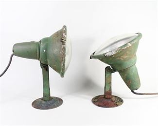 Lot 334: 2 Green Industrial Age GE General Electric Spotlights. Matching pair of cone shaped lights are adjustable and painted green. Marked GE on the metal and glass.
The lamps have not been tested for function, may need to be rewired.
Dimensions are 13.75 in h x 8.5 in w x 9 in d. Condition is fair/as-is with heavy wear, paint loss, severe wear to the base, rust and an odor. Please call or email for a detailed condition report.