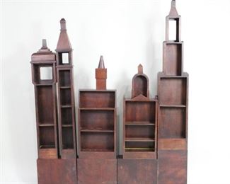Lot 344: 5 Folk Art Deco Skyscraper Tower Bookcases,Shelves. A set of fun skyscraper bookcases in the style of David Rudolph or Paul Frankl. Comes with four block pedestals and can be moved around for desired effect to create a city skyline or use as single book towers.

Dimensions are 43.5 in h x 16 in w x 12 in d. Condition is good. Light wear to wood. Some glue residue. Please call or email for a detailed condition report.