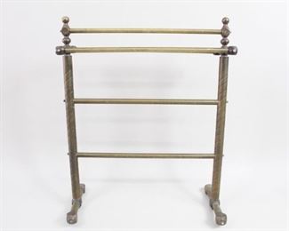 Lot 348: Victorian Brass Towel Blanket Hanging Rack,Butler Stand. A freestanding towel rack in brass with five rails. Spiral decor on the sides and beautiful finials on top. 

Dimensions are 34 in h x 26 in w x 13 in d. Condition is as is. Missing casters, which makes it tilt. Wear to brass. Non matching bolts. Please call or email for a detailed condition report.