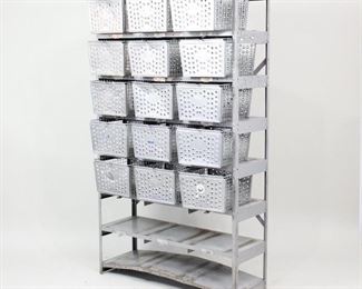Lot 367: Industrial Commercial 8 Shelf Storage Unit w/Baskets. Large metal shelving unit with eight shelves and fifteen perforated wire baskets. Loops on front of shelves matches with baskets and allows for locking them in place. Cross stretcher on the back for extra support. Great storage unit for a retail store, workshop or perhaps a hallway or living room for an industrial look. 

Dimensions are 68.75 in h x 40.25 in w x 13.25 in d. Condition is good. Bottom shelf is dented. Spots of surface oxidation and scratches. Stickers throughout. Please call or email for a detailed condition report.