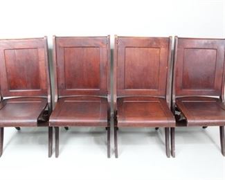 Lot 370: Set of 4 Deco Reddish Brown Panel Wood Folding Chairs. These folding chairs have a distinct featuring solid veneer panels over seat bottom and back, rather than parallel slots like most antique folding chairs. Darkly stained, resembling mahogany or cherry. This combined with their subtle curvature imparts an Art Deco quality, though date ot manufacture is unknown.

Dimensions are 36.5 in h x 19 in w x 21.5 in d. Condition is very good, with minor surface wear and wear to edges, corners, and feet. Underside lower brace on one is damaged. Please call or email for a detailed condition report.