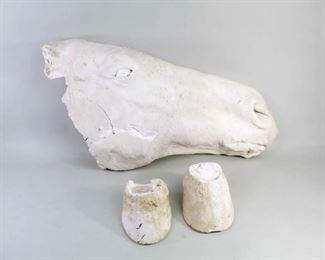 Lot 381: Horse & Hooves Plaster Death Mask. This highly unusual antique set of horse head death mask and hooves is made of white plaster. Wire has been embedded on the head for hanging; display on a deeply hued wall with the hooves on a pedestal below for a stunning presentation.
Dimensions are 12 in h x 23.5 in w x 4.5 in d for the head; hooves are 3 in h x 4 in w x 5.25 in d. Condition is fair with cracking and fragility, surface wear & some discoloration. Please call or email for a detailed condition report.