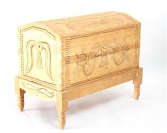 Lot 394: Mexican Folk Art Carved Pine Chest Trunk, Baul Michoacan. Beautiful and immaculate pine chest elaborately hand carved with floral and feather motifs in Cuanajo. Lid has metal hinges, and chest rests on removable stand. Wonderful storage trunk for linens or small treasures. Acquired Michoacan Mexico in the mid 1980’s. From the collection of Barbara Porter & Robert Wincuinas.

Dimensions are 26 in h x 33 in w x 19 in d. Condition is very good. Please call or email for a detailed condition report.