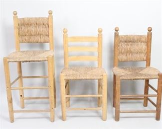 Lot 395: 2 Woven Straw Wood Ladderback Chairs & High Stool Haiti. This matching series of 3-slat ladderback chairs are made of woven straw seat and back over wood frames. Two of the backs have slats also covered in weave. Identical design but slight variations in color, suggesting a folk art or cottage industry origin. Marked "HAITI".

Dimensions of chairs are 37 in h x 20 in w x 16 in d, with 19 inches to seat. Stool is 44.5 in h x 19 in h x 16 in d, 28 in to seat. Condition is good, with wear to straw. Stool missing one cross brace near bottom. Please call or email for a detailed condition report.