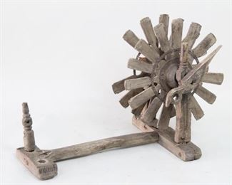 Lot 401: Antique Indian Colonial Era Wood Charka Spinning Wheel. An Colonial era Indian spinning wheel, known as "Charka" in turned and carved wood with metal reinforcements. A beautiful decorative object. From the collection of Barbara Porter & Robert Wincuinas.

Dimensions are 18 in h x 36 in w x 24 in d. Condition is fair to good. Heavy surface wear throughout. Some missing and broken parts. Please call or email for a detailed condition report.