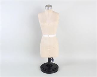 Lot 437: Diminutive Wolf Dressmakers Women's Model Cloth Form. Small female dressmaker's form is tan cloth covered and stands on a metal base marked Wolf. Height is adjustable from 20.25 to 34.25 inches tall. Would be great for a retail display, or perhaps for product photography for your online business.
 
Dimensions are 34.25 in h x 6.25 in w x 6.25 in d. Condition is very good with some wear and scratches on the metal shoulder and neck. Please call or email for a detailed condition report. 