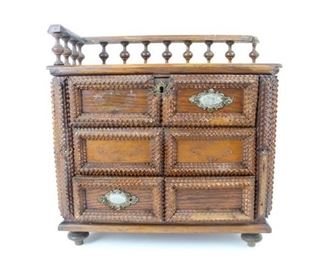 Lot 440: Miniature Tramp Art Wooden Dresser, featuring 3 drawers, lock and key, and banister. Footed, but also has hardware on back for hanging on wall. This piece would function well as a jewelry box or as a display piece.
 
The dimensions are 15 in h x 14.5 in w x 6.5 in d. Condition is fair, with missing handles on the right side of banister. Please call or email for a detailed condition report.

