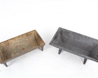 Lot 442: A pair of small vintage cast iron troughs probably once used as ash pans in fireplace inserts or other applications. One reads "keep water in his pan" and underside says "Backus Mfg Co B." Both undersides have gate marks suggesting pre-1890 age. These would make adorable feeding troughs for your pets.

Dimensions are 3 in x 11.75 in x 6.25 in (shorter) and 4.25 in x 12.5 in x 7.25 in (taller). Condition is fair, with wear and rust throughout, and general surface wear. Please call or email for a detailed condition report.
