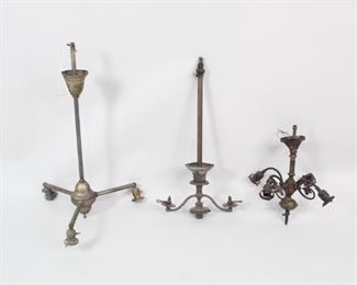 Lot 459: Lot 3 Metal Patina Hanging Chandelier Light Fixtures. Metal appears bronze or brass, having developed a nice patina. Different heights and number of arms, some with graceful curvature and some foliate motifs. Aged metal finishes are easy to mix and match in interior design, especially with the addition of matching shades.

Dimensions range from 17.75 in h x 16.75 in w x 16.75 in d to 31.75 in h x 19.5 in w x 19.5 in d. Condition is good, with surface wear an spots to metal and a few dents. The lights have not been tested for function, and may need to be rewired. Please call or email for a detailed condition report.