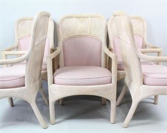 Lot 462: Set/6 Pink Upholstered McGuire Style Split Reed Rattan Chairs. Elegant matching armchairs have frames covered in pencil reed veneer in an unusual geometric pattern, with rounded corners and backs. Backs and seat cushions are upholstered in pale pink. Stylish set for your covered patio or sunroom. 
Dimensions are 38.75 in h x 23 in w x 18 in d. Condition is very good with minor surface wear, some stains on the upholstery and wear to the wood. Please call or email for a detailed condition report.