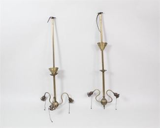 Lot 464: Pair of Antique Early 20th C Electric Brass Chandeliers. A pair of electric chandeliers from the early 20th century in brass. Almost identical, though one has three-arms and the other has two. Both have ball endings and light switch pulls for each arm.

Dimensions are 44 in h x 15.5 in w x 4.5 in d. Condition is good. Surface wear and spots throughout. The lamps have not been tested for function, may need to be rewired. Please call or email for a detailed condition report.