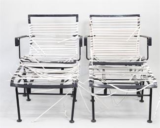 Lot 469: Pair of Wrought Iron Patio Lounge Chairs w/Foot Stools. A set of garden or patio chairs with foot stools in wrought iron. Partial vinyl weave in white remaining on back, seats and foot stools. Scrolled detail on the arms.

Dimensions for chairs are 29.14 in h x 26.5 in w x 25.5 in d. Dimensions for stools are 29 in h x 22 in w x 23 in d. Condition as is. Wear to metal and paint. White vinyl coming off, needs to be replaced. Please call or email for a detailed condition report.