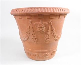 Lot 472: Large Terracotta Outdoor Garden Patio Planter Urn Pot. A terracotta planter with a beautiful design; a mans face or mask flanked by floral garlands and a seashell border. Great planter for a patio or by an entrance.

Dimensions are 19.5 in h x 23.25 in w x 23.25 in d. Condition is very good. Please call or email for a detailed condition report.