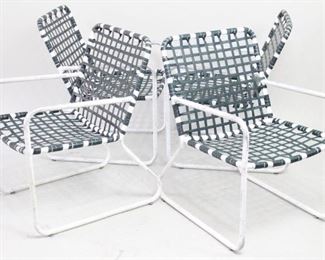Lot 471: 4 Brown Jordan Aluminum Outdoor Garden Patio Chairs. Wonderful set of vintage matching armchairs have white metal frames, with seats and backs made of green woven plastic. A real upgrade from your average lawn chairs.
Dimensions are 30.25 in h x 20.5 in w x 24.5 in d. Seat height is 15.25 in h. Condition is good with white paint chipped and scratches throughout. Straps are strong and integrity is sound. Please call or email for a detailed condition report.
