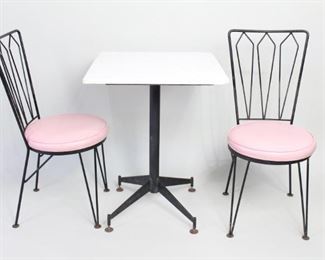 Lot 481: 1950s Style Cafe Patio Marble Table & 2 Pink Chairs. A lovely set with a white, marble top metal table and two metal chairs with pink vinyl cushions. Perfect in a cafe, patio, garden or a breakfast nook.

Dimensions for table are 30.5 in h x 24 in w x 24 in d. Dimensions are 36 in h x 16 in w x 15 in d. Condition is good. Some chipping on the corners of marbles. Discoloration to pink cushions, surface wear on rust. Please call or email for a detailed condition report.