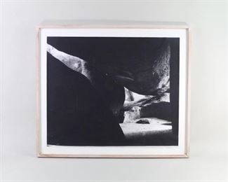 Lot 483: B&W Photo Virgin Gorda BVI Sarah Griffin Banker 1987. Fascinating black & white photograph (likely a silver gelatin print) by NY photographer Sarah Griffin Banker, who is known for her images of rocks and rock formations. Signed in pencil by the photographer and titled "Virgin Gorda Series #2" on the back. Matted in white and framed in wood.
Dimensions are 24 in h x 27.75 in w x 1.25 in d. Condition is good with inner dirt & stain spots, and minor surface wear and discoloration to the frame. Please call or email for a detailed condition report.