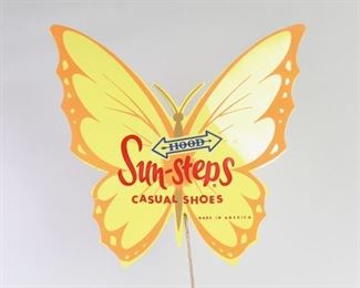 Lot 490: Mid-Century Modern Sunsteps Butterfly Shoe Display Rack. Wonderful shoe store display rack has a bright and colorful yellow and orange plastic butterfly at the top of a metal corkscrew stand, which is made to display 7 shoes. Original cardboard box included. Perfect display item for a vintage clothing shop.
Dimensions are 35 in h x 14 in w x 8 in d. Condition is good with surface scratches to the metal base. Please call or email for a detailed condition report.