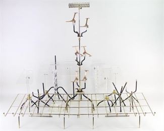 Lot 498: Collection of 12 Shoe Display Stands Metal Brass Lucite. These shoe stands, in a variety of styles, shapes, and materials, are united by their purpose-built design and craftsmanship, making an excellent collection to display your shoes or other items. Could make great retail displays, objets d'art in their own right.

Dimensions range from 36 in h x 2.1 in w x 10 in d, to 15 in h x 6.5 in w x 6.5 in d. Condition is good, with minor wear to finish of black pointed stands, some scuffing and scratching and discoloration on lucite. Please call or email for a detailed condition report.