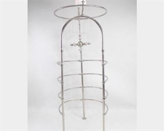 Lot 297: Antique French Ribcage Needle Shower w/Porcelain Head. An incredible freestanding nickel plated ribcage shower by French maker Porcher. The four enclosing ribs are pierced, allowing water to be sprayed from all sides and above. Unusual for this type is the beautiful shower head made in porcelain. Shower handles with porcelain plaques are marked in French with "Porcher" and, right and left with "chaud" and "froid," and top and bottom with "douche." This type of shower was popular in wealthy Victorian homes and is truly like a home spa. Dimensions are 90.25 in h x 31.25 in w x 24.5 in d. Condition is very good. Ceramic is slightly discolored. Text on knobs worn. One foot is slightly damaged. Please call or email for a detailed condition report.