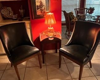 Two navy leather chairs, lamp and table