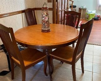 Round kitchen table with six chairs. Great for apartment. 48 inches round. Includes two leaves.  Each Leaf 18”. 