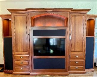 $3000 Stunning and The PERFECT Custom Entertainment Center with Built in Speaker Screens (Speakers sold Separate) and Tons of Storage! This Piece Comes Apart but will require Professional movers to disassemble and move.                             
Measures: 136x27x89