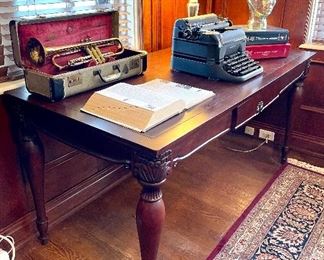 $250 Bombay Co. Executive Desk Single Center Drawer Measures: 62x30x30                                                  $50  Antique Trumpet In Case 