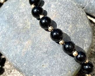 $250; vintage bead necklace and bracelet set with 14KT gold and black (onyx or obsidian); purchased at Tiger’s Eye; 28” necklace