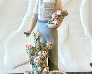 $120; Lladro sculpture of little girl with roses; 9” high