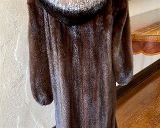 stunning view of the back of the full-length mink with removable hood
