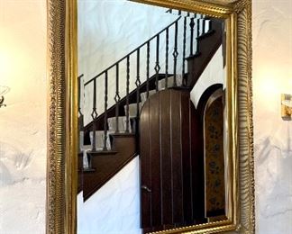 $400; gold gilded framed mirror with carved details and beveled edge; 39”w x 49”h