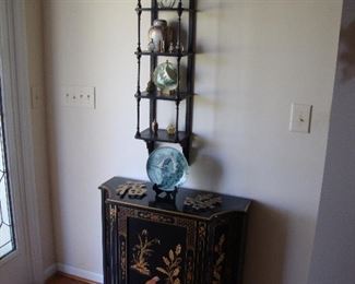 Entrance side table, delicate curio shelf and collection of plates and glass bottles 