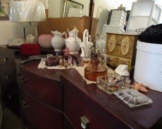 large dresser, perfumes and small vanity items