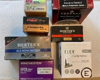 Boxes of ammunition (44 Mag., 12-guage shotgun shells, 9mm, .223 Remington, and .22LR. )
