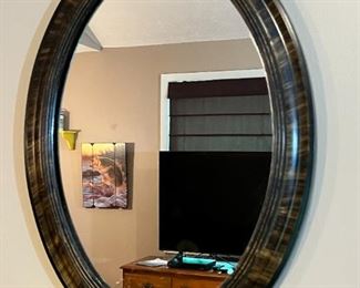 Framed oval mirror