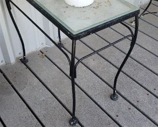 many pieces of iron outdoor furniture