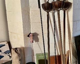 Shepards hooks, tiki torches, garden ornaments are all priced at the sale.