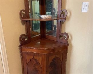 Vintage style corner cabinet with hand carved shelves and mirror inlaid mahoganh