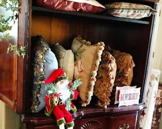 Mahogany Armoire full of needlepoint pillows