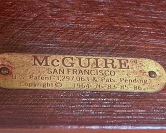 A fabulous 4x4 McGuire coffee table with a black granite top.