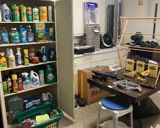 Household cleaning supplies, many, many new and unopened bottles.