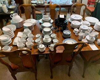 The dining room Baker table full of the family’s dishware. There is a large full set of Dansk Mesa White Sand, a large full set of Noritake, Regent Platinum, a partial set of Miska Rondo, a few pieces of Currier and Ives in blue, and a large collection of vintage Noritake Blue Haven plus, plus, plus!!