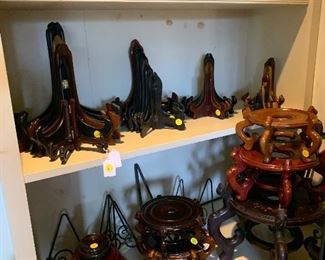 A large selection of easels and ornament stands