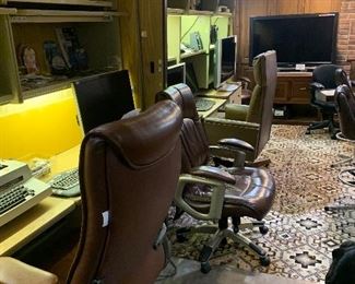 In the area of the office we have multiple professional office cubicles along with office chairs, monitors and keyboards. There are other electronics, several flat screen TVs DVD players and much more!