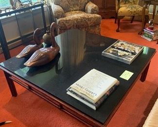 A wonderful 4x4 foot vintage McGuire coffee table with black granite top. Best of the best!
